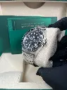 ROLEX SUBMARINER DATE BLACK DIAL STAINLESS STEEL RIGHT SIDE IN HAND PIC FOR MASTER.webp