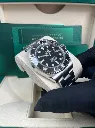 ROLEX SUBMARINER DATE BLACK DIAL STAINLESS STEEL LEFT SIDE IN HAND PIC FOR MASTER.webp