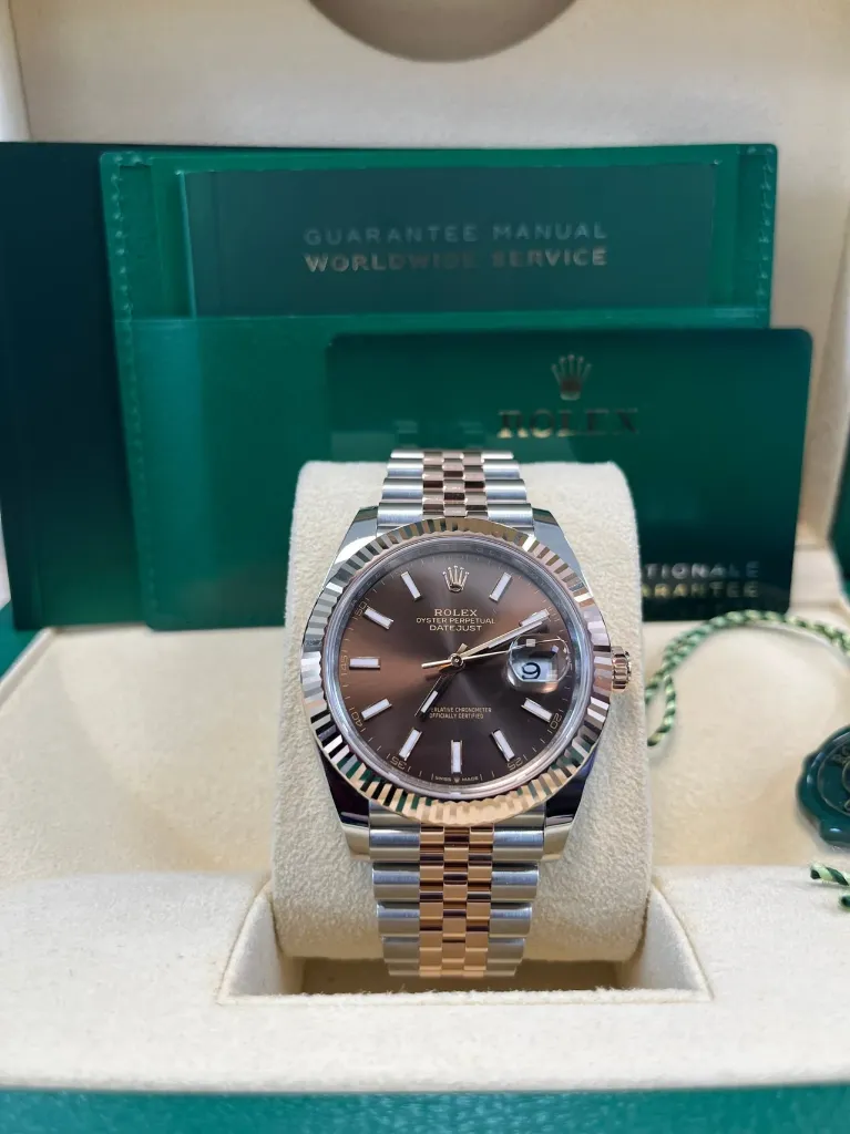 ROLEX DATE JUST ROSE GOLD CHOCOLATE DIAL JUBLIEE FLUTED BEZEL IN BOX A LILL UP PIC FOR MASTER.webp
