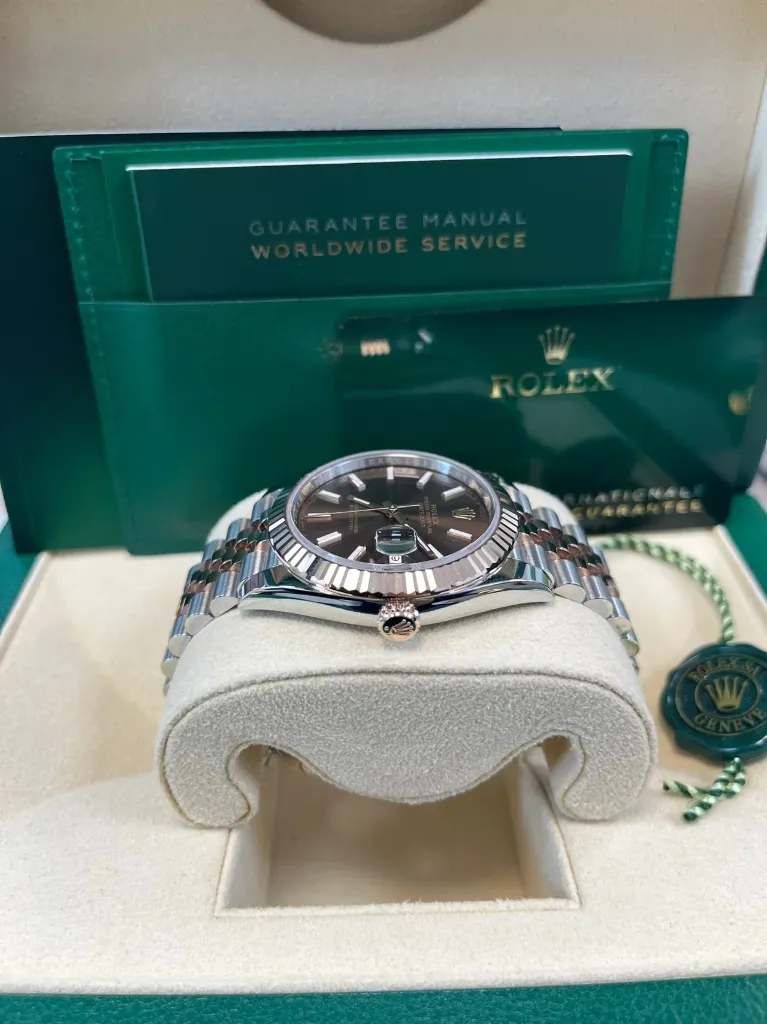 ROLEX DATE JUST ROSE GOLD CHOCOLATE DIAL JUBLIEE FLUTED BEZEL CROWN SIDE PIC FOR MASTER.webp